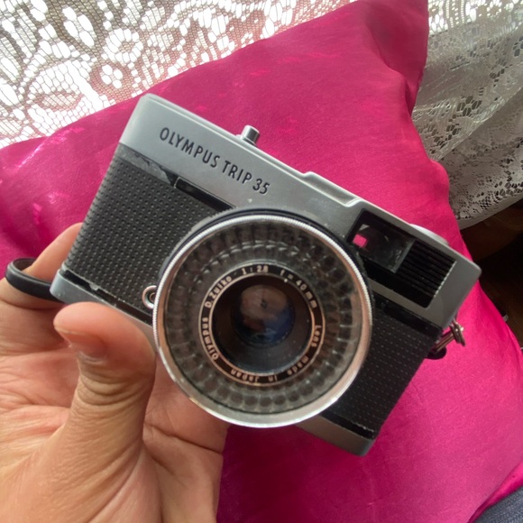 Vintage film camera with classic design, featuring silver  Silver and Black Film Photography Camera with Vintage Design